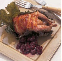 Roast quail wrapped in pancetta and vine leaves with grape confit