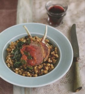 Roast rack of lamb on Israeli cous cous with tomato. tamarind and coriander relish