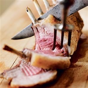 Roast rack of lamb with aubergine, goat's cheese and spring herb bake