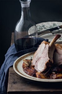 Roast rack of pork with peaches and pomegranate molasses