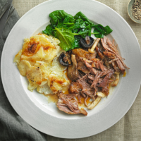 Roast shoulder of lamb with mushrooms, balsamic vinegar and potatoes Dauphinoise