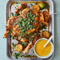 Roast spatchcock chicken with coriander, red chilli and charred limes