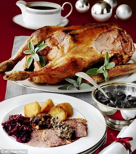 Roast stuffed goose with apples and prunes in Armagnac