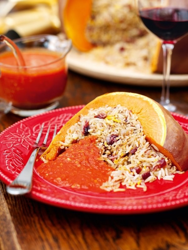 Roast stuffed pumpkin with gingery tomato sauce