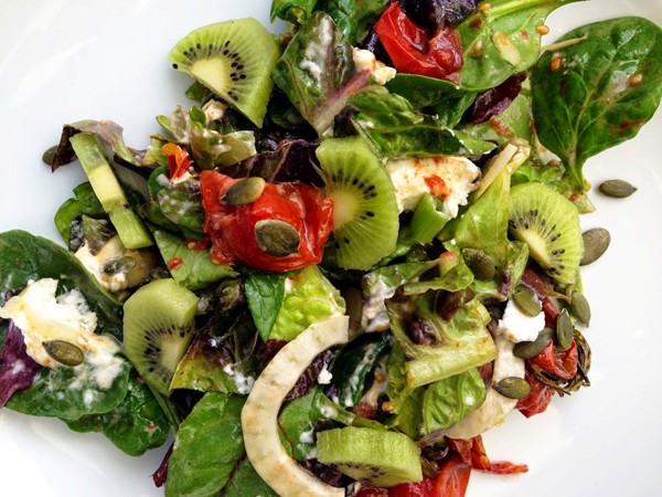 Roast tomato and goats cheese salad with Maldon smoked salt and kiwi fruit