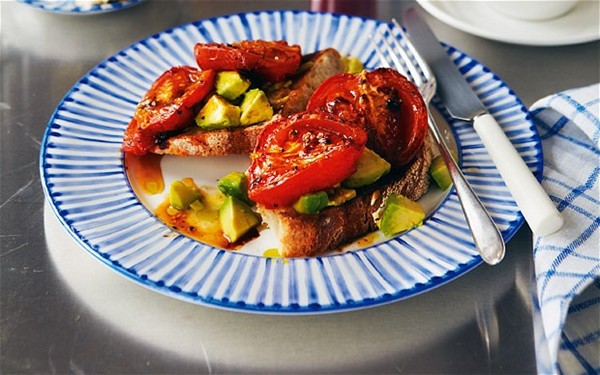 Roast tomatoes and crushed avocado on toast