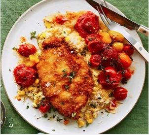Roast tomatoes, chicken schnitzel & cheesy creamed corn