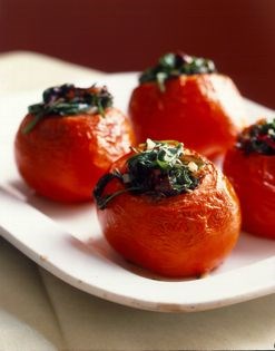 Roast tomatoes stuffed with bitter greens