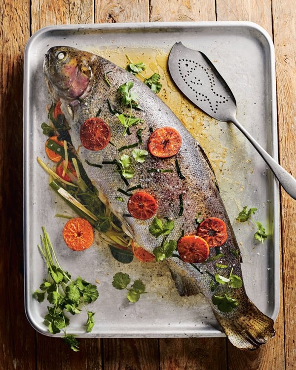 Roast trout with clementine, ginger, spring onion and herbs [Jude Kereama]