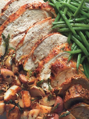 Roast turkey breast with potatoes, green beans, and mustard pan sauce