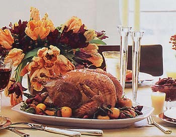 Roast turkey with apples, onions, fried sage leaves, and apple cider gravy