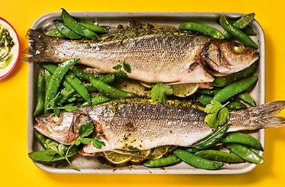 Roast whole sea bass with green tikka, coriander & lime