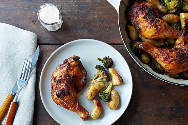 Roasted achiote chicken with potatoes, broccoli, and tangerine aioli