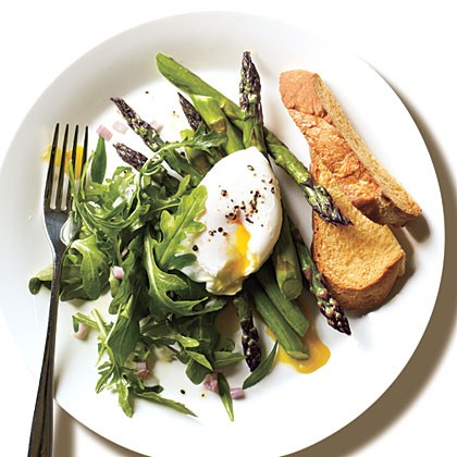 Roasted asparagus and arugula salad with poached egg