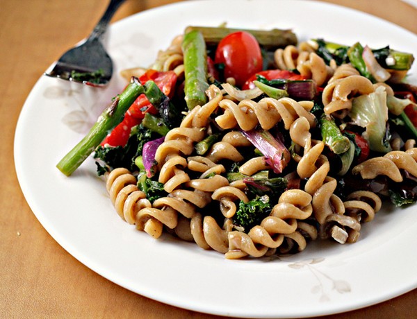 Roasted asparagus and tomato pasta salad with goat cheese