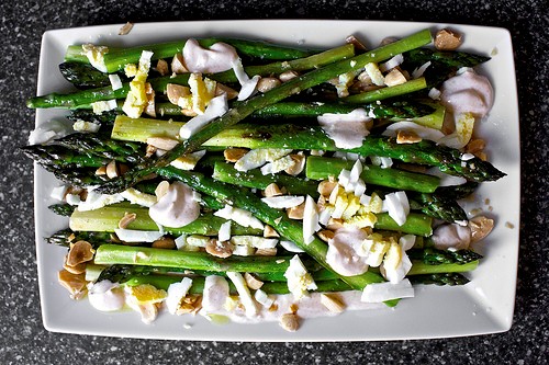 Roasted asparagus with smoky lemon yogurt, chopped eggs and toasted almonds