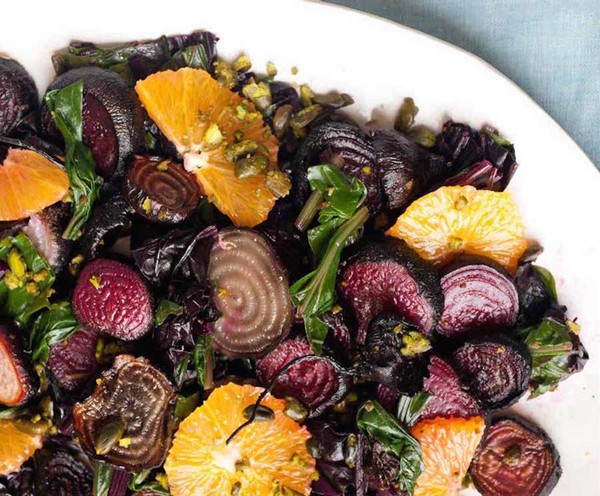 Roasted beet salad with beet greens, oranges, and pistachios