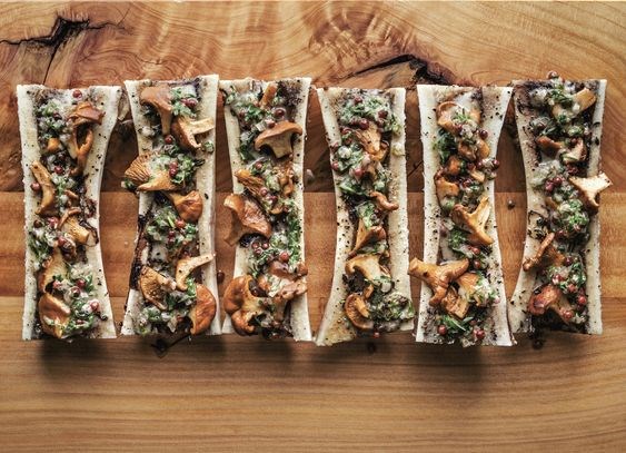 Roasted bone marrow with chanterelles, pink peppercorns, and cider vinegar