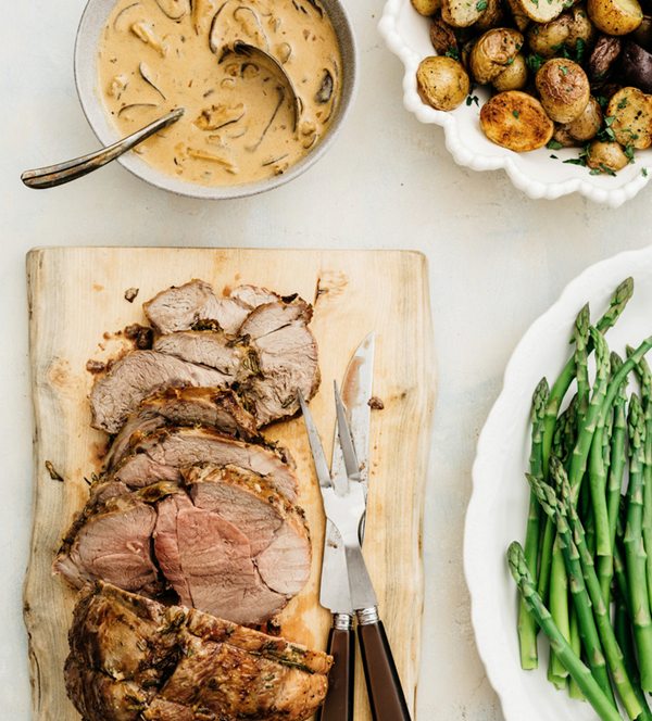 Roasted boneless leg of lamb with mushroom cream sauce