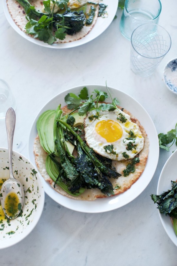 Roasted broccoli rabe tostada with avocado, fried egg and chimichurri