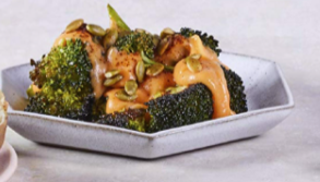 Roasted broccoli with cheese sauce, chipotle and toasted pepitas