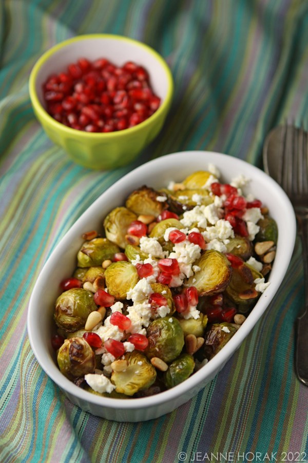 Roasted Brussels sprouts with feta, pomegranate and pine nuts