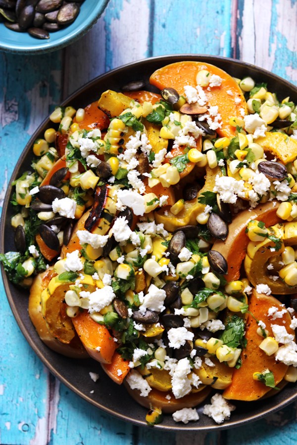 Roasted butternut squash with sweet corn salsa, feta, and pepitas