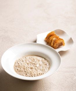 Roasted button mushroom soup with toasted chorizo-potato raviolis