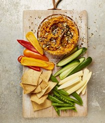 Roasted carrot and garlic dip with seed dukkah