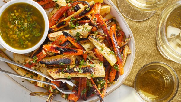 Roasted carrots and parsnips with almond-herb sauce