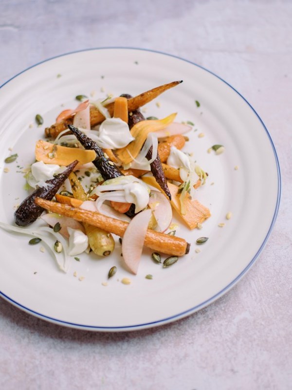 Roasted carrots with spiced pumpkin seeds, peaches and crème fraîche