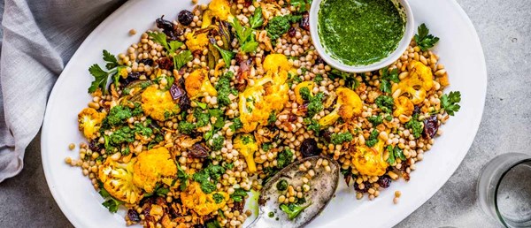 Roasted cauli and couscous salad with zhoug and crispy shallots