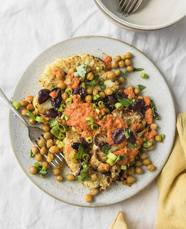 Roasted cauliflower steaks with red bell pepper-almond sauce