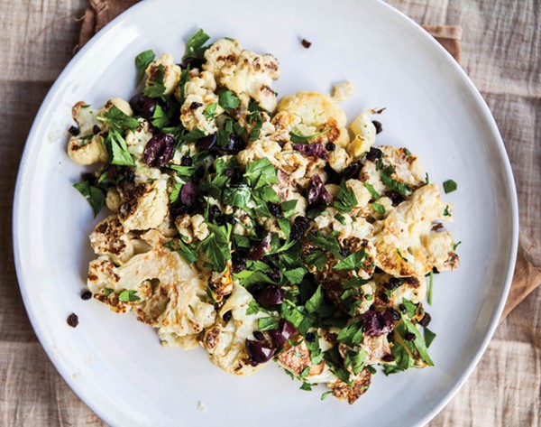 Roasted cauliflower with olives, currants, and tahini dressing from 'Vibrant Food' (Cook the Book)