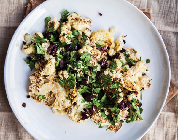 Roasted cauliflower with olives, currants, and tahini dressing