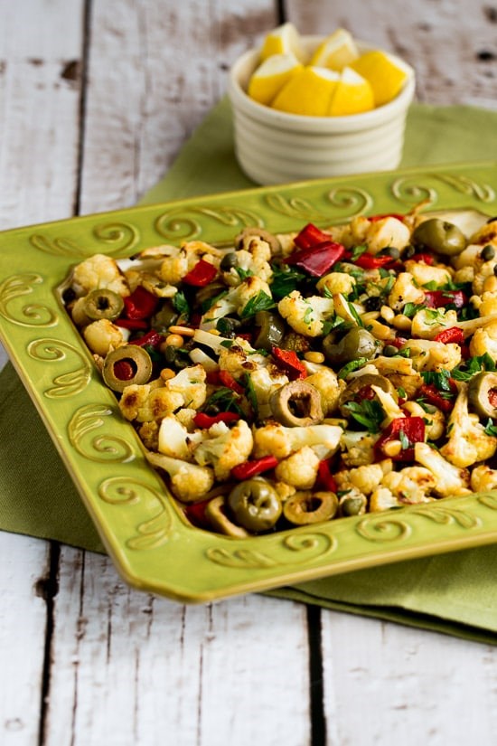 Roasted cauliflower with red bell pepper, green olives, and pine nuts