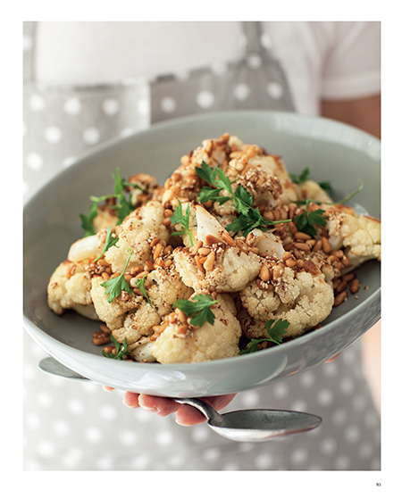 Roasted cauliflower with spiced yoghurt and pine nut and sesame topping