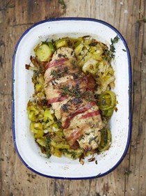 Roasted chicken breast wrapped in pancetta with leeks and thyme