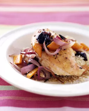 Roasted chicken breasts with carrots and onion