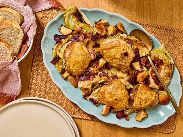 Roasted chicken thighs with bacon, apples, and cabbage