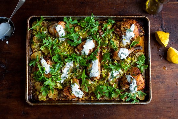 Roasted chicken with potatoes, arugula and garlic yogurt