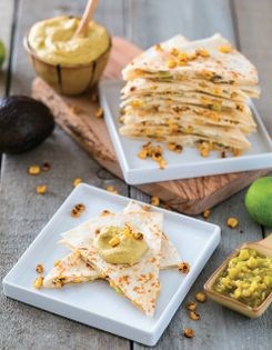 Roasted corn, green chile & tofu chèvre quesadillas with avocado crema