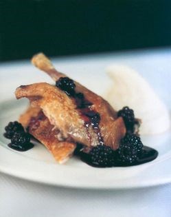 Roasted duck with red wine blackberries