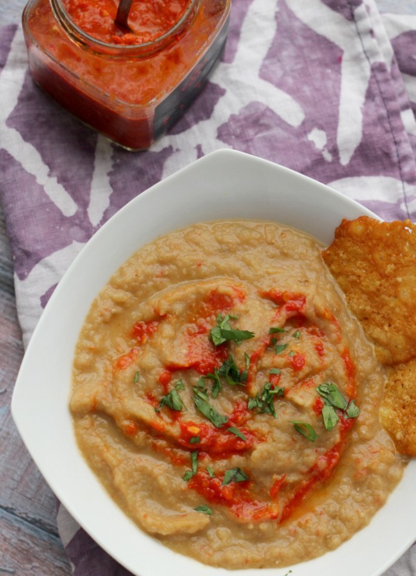 Roasted eggplant bisque with harissa and Parmesan crisps