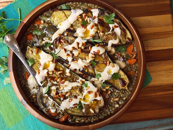 Roasted eggplant with tahini, pine nuts, and lentils