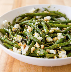 Roasted green beans with goat cheese and hazelnuts