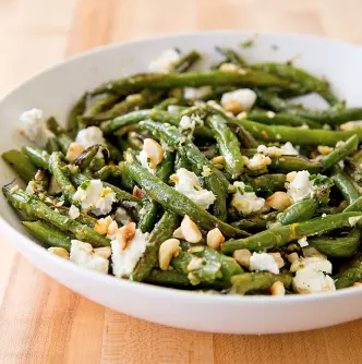 Roasted green beans with goat cheese and hazelnuts