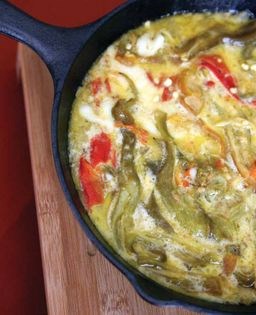 Roasted green chiles with buttermilk and cheese (Rajas con suero y queso asadero)