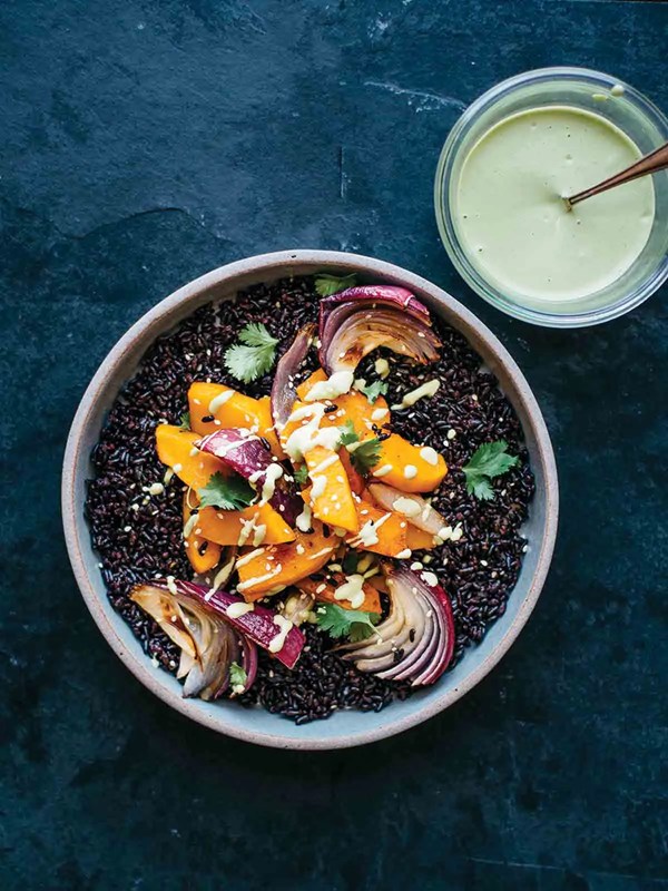 Roasted kabocha squash with black rice and chickpea-sesame dressing