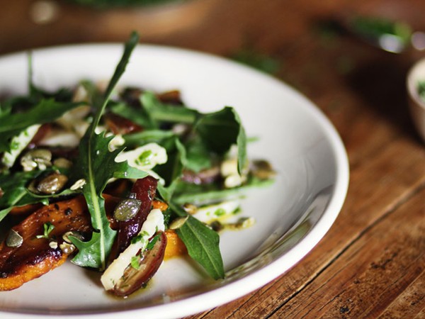 Roasted kabocha squash with dates, Parmesan, and pepitas